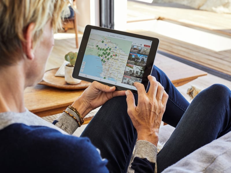 Zillow customer browsing through listings on a tablet